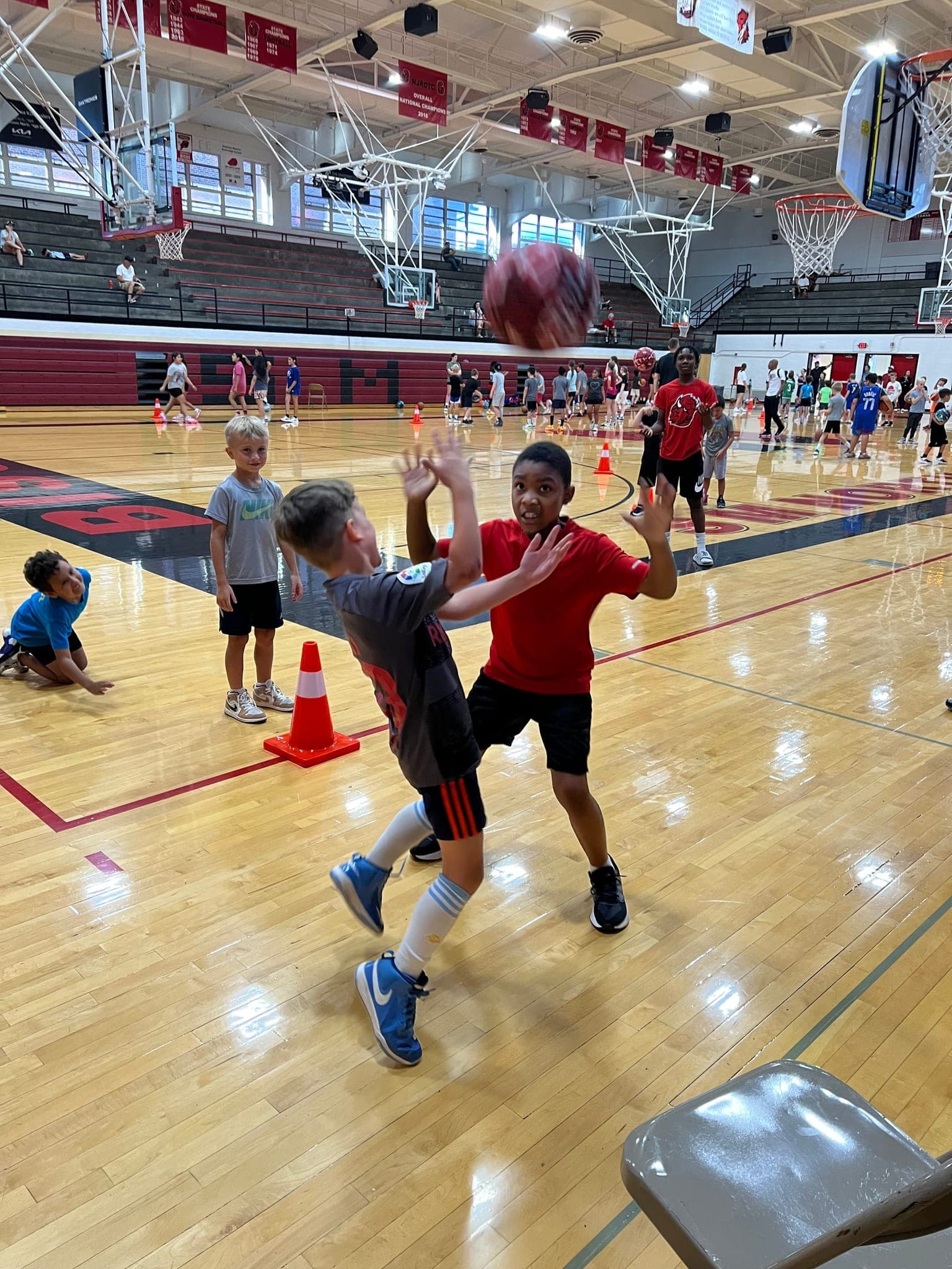 A young camper going up for a shot
