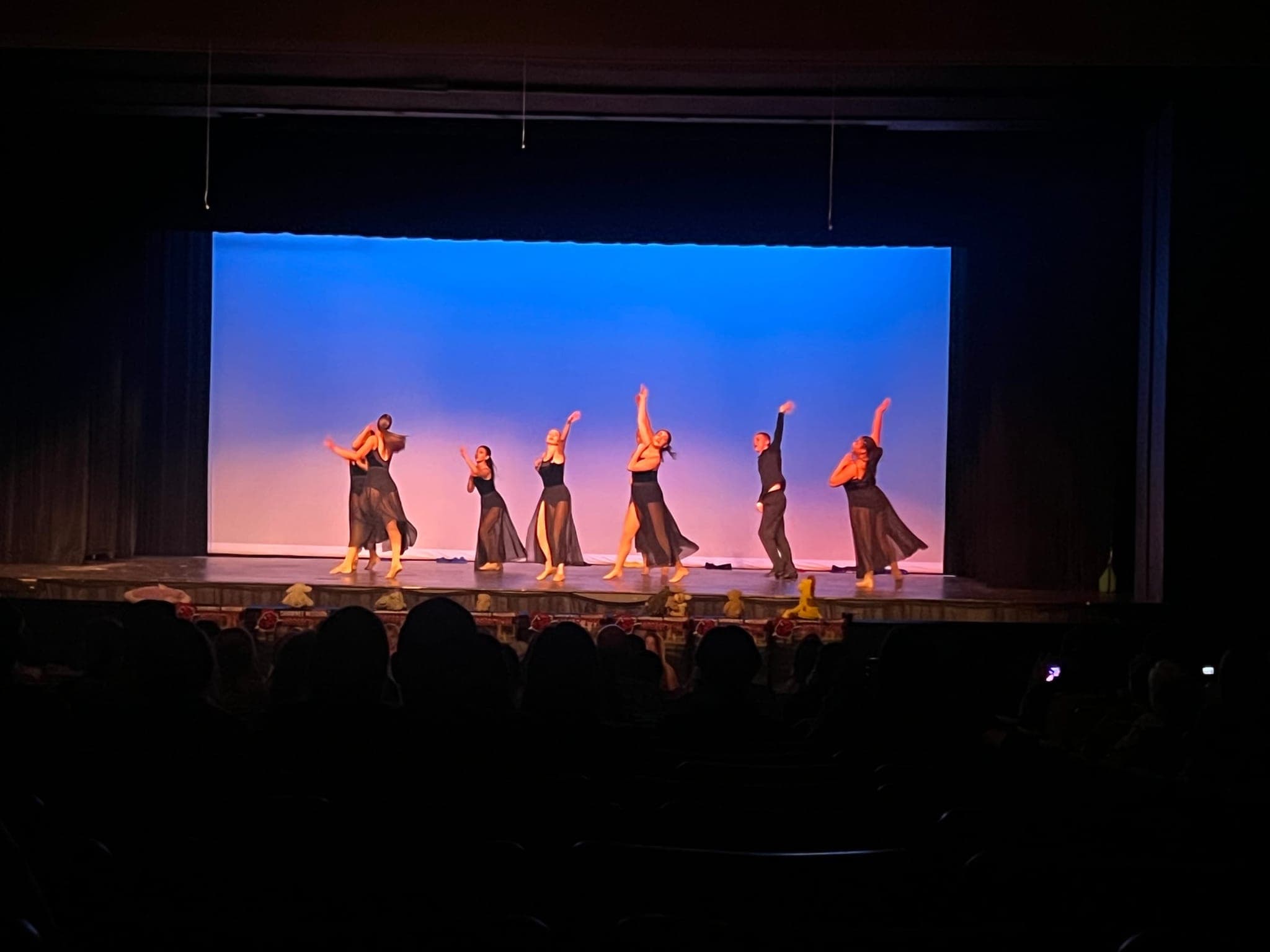 Dancers performing together on stage